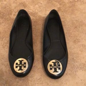 Black Tory Burch flats with gold emblem